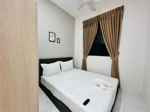 a bedroom with a white bed with a window at The Sun 1 or 3BR Bayan Lepas 4 to 10 pax WL in Bayan Lepas