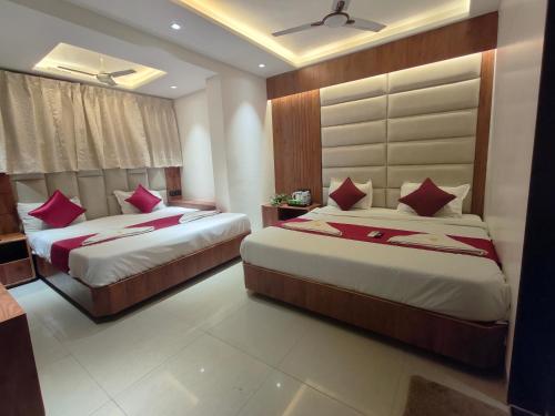 Katil atau katil-katil dalam bilik di Hotel Anand Palace