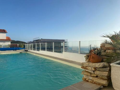 a swimming pool on top of a building at Santa Efigênia in Lourinhã