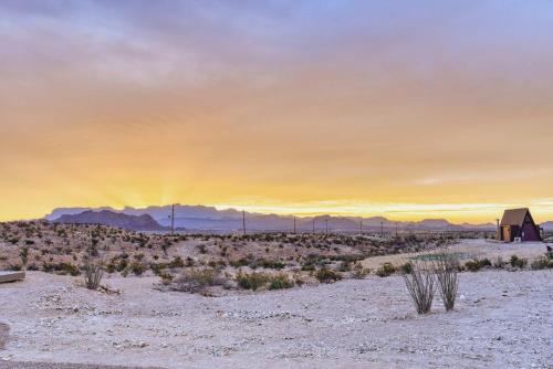 a view of the desert with a barn and the sunset at Stardust Big Bend Luxury A-Frame#5 great views in Terlingua