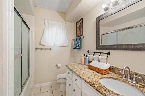 a bathroom with a sink and a toilet at 4bd Near Airport & Downtown - Volleyball - Games in Irving