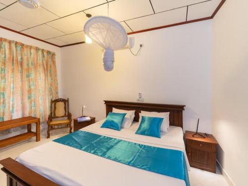 Ένα ή περισσότερα κρεβάτια σε δωμάτιο στο Araliya Villa Moragalla