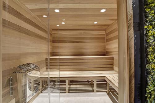 a sauna with a bench in a wooden wall at Full ocean view Huge private terrace 1002 in Miami Beach