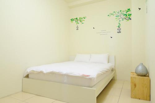 Cama o camas de una habitación en Sanyi Happiness B&B