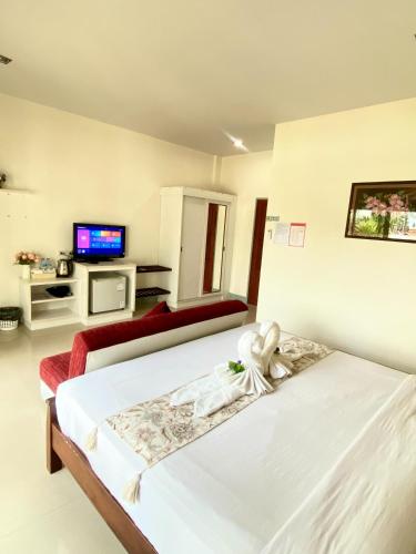 Postel nebo postele na pokoji v ubytování Lanta Just Come Hotel
