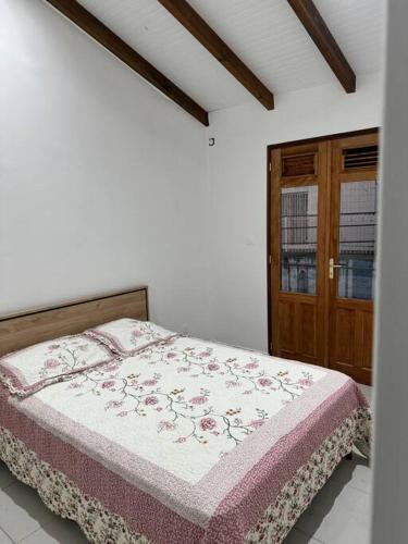 Ένα ή περισσότερα κρεβάτια σε δωμάτιο στο Le Gosier Coastal Residence