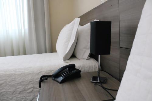 Hotel Acrópolisにあるベッド