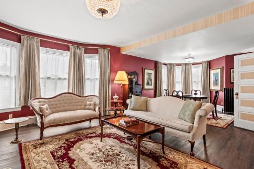 a living room with a couch and a table at The Audrey - Springfield in Springfield