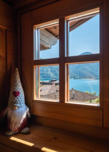 a window in a room with a view at Casa Monica Ledro Attico in Mezzolago