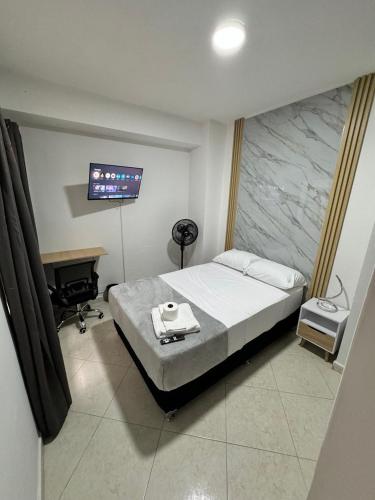 Una cama o camas en una habitación de Verde Primavera