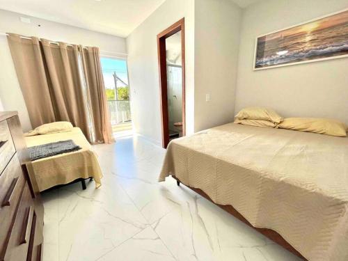Katil atau katil-katil dalam bilik di Triplex Moderno