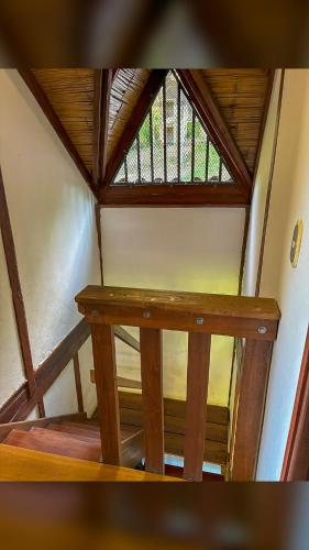 a wooden table in a room with a window at Finca con piscina los Eucaliptos Cali- Pance in Cali