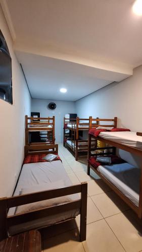 a room with a bunch of bunk beds at Hostel My House quartos perto do aeroporto de Guarulhos in Guarulhos
