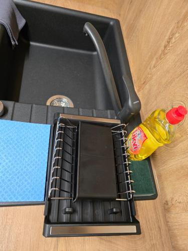 a laptop computer sitting on top of a table at Apartman FIŠBAH 4 self CHECK-IN, FREE PRIVATE PARKING in Osijek