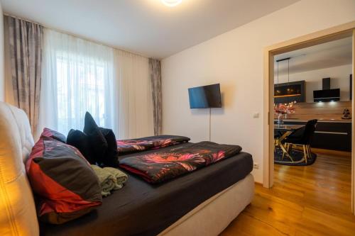 a couch with pillows on it in a room at Bennett Apartment in Vienna