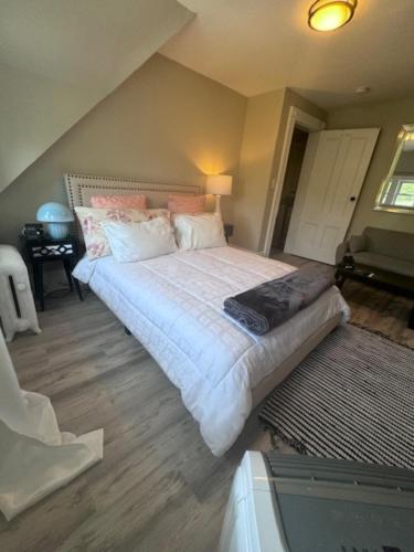 a bedroom with a large bed in a room at Bloom Victorian Bed & Breakfast in South Orange