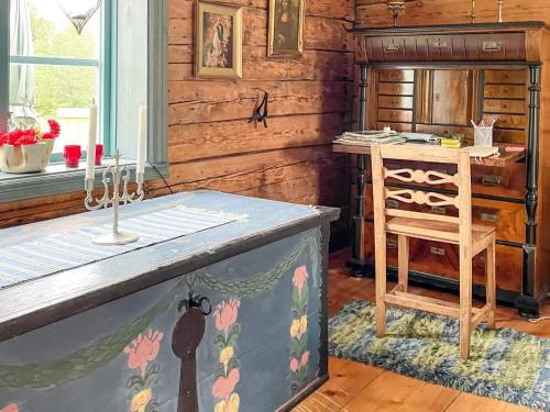 a kitchen with a counter and a desk in a room at 4 person holiday home in VIRSERUM in Virserum