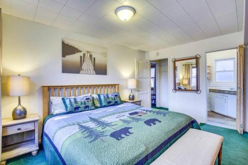 a bedroom with a large bed and a mirror at The Twin Pines Chalet, 2 min to Village, BBQ in Big Bear Lake