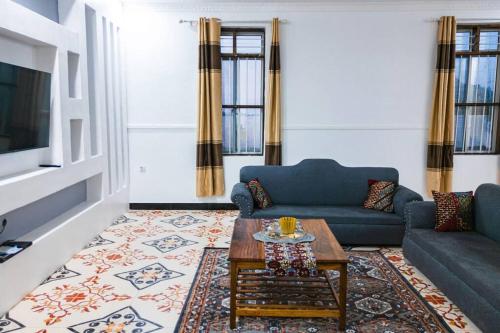 a living room with a couch and a coffee table at Bahari Bliss in Makunduchi