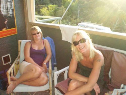 two women sitting in chairs on a boat at Spacious House or Units near town Low cost in Paihia