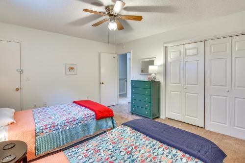 a bedroom with two beds and a ceiling fan at Seneca Escape with Screened Patio Near Lakes! in Seneca