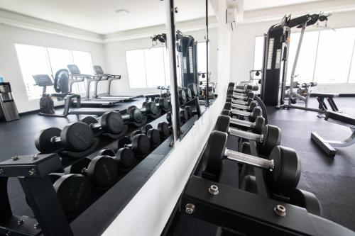 a gym with rows of dumbbells and other equipment at Exclusivo apartamento - Soha Suites II-B9 - 2 BR in Rincón Largo