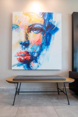 a painting of a woman on a wall at Exclusivo apartamento - Soha Suites II-B9 - 2 BR in Rincón Largo