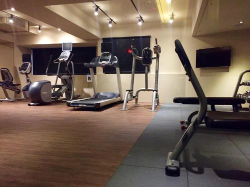 a gym with several exercise equipment in a room at Inhouse Hotel Taichung in Taichung