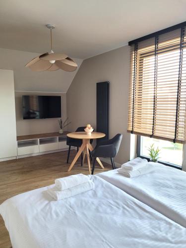 Ένα ή περισσότερα κρεβάτια σε δωμάτιο στο Apartamenty K17 Stare Miasto