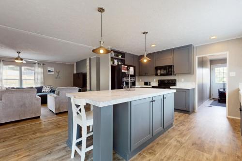 an open kitchen and living room with a large island at Cove Creek Escape in Jacksboro