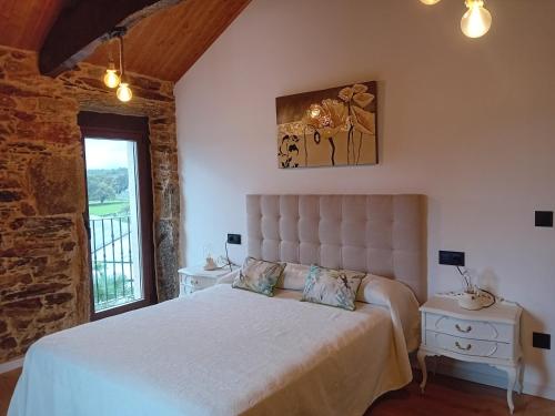 Ένα ή περισσότερα κρεβάτια σε δωμάτιο στο Casa do Outeiro