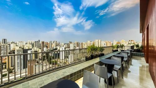 a balcony with a view of a city skyline at 360 VN Turiassú by Housi in Sao Paulo