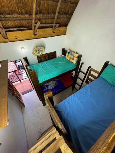 an overhead view of a room with two beds at Hostal Nibuni Palomino in Palomino