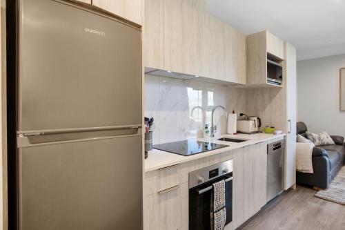 Η κουζίνα ή μικρή κουζίνα στο Augustus Harmony Apartment with Parking - Air-con