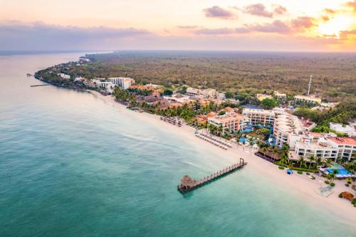 an aerial view of a resort on a beach at Secrets Aura Cozumel - Adults Only in Cozumel