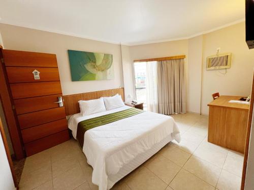 Postel nebo postele na pokoji v ubytování Hotel Dom Leopoldo
