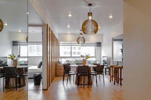 a dining room with a table and chairs at Cozy & Stylish apartmen @ New Polanco 3bed/2.5bath in Mexico City