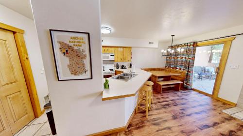 a kitchen and dining room with a sink and a counter at The Rock #3461 in Moab