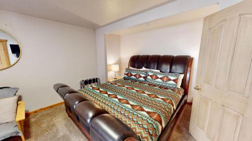 a bedroom with a leather bed in a room at The Rock #3461 in Moab