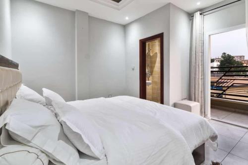 Ένα ή περισσότερα κρεβάτια σε δωμάτιο στο La Maison H 002
