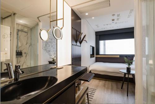 Postel nebo postele na pokoji v ubytování CitiGo Hotel Shanghai JingAn