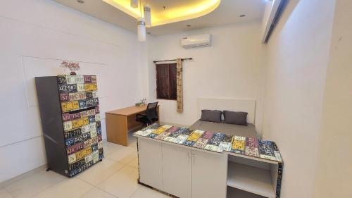 a room with a counter with a lot of magazines at Homestay Fairy's House in Ho Chi Minh City