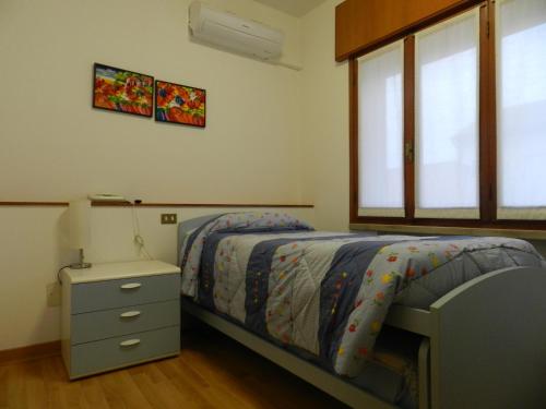 Postel nebo postele na pokoji v ubytování Locanda Trattoria Caffè Cavour
