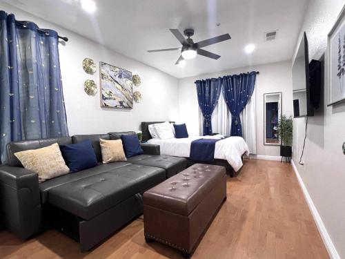 a living room with a couch and a bed at NEW! 2-Bedroom Fontana Guest House close to Kaiser Permanente in Fontana