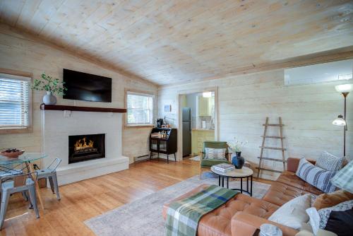 a living room with a couch and a fireplace at The Zen Den Peaceful Cottage with Mountain Views in Banner Elk