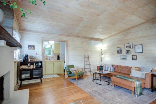 a living room with a couch and a table at The Zen Den Peaceful Cottage with Mountain Views in Banner Elk