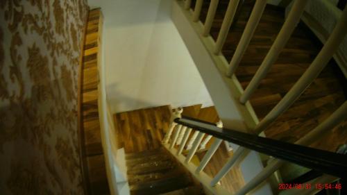 an overhead view of a wooden spiral staircase at Hotel Casona del Truco in Guanajuato