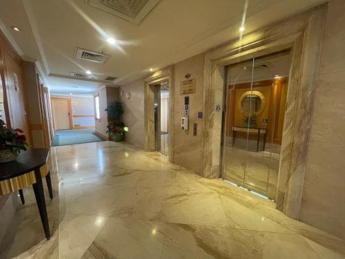 a hallway of a building with a glass door at Chuto Plaza Hotel in Taoyuan