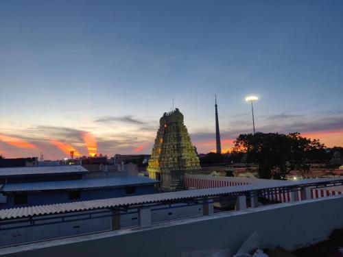 a view of a temple at sunset at Siva Lodge in Rāmeswaram