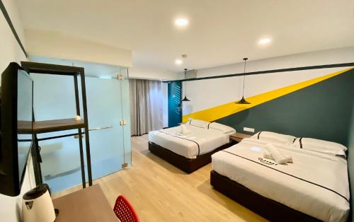 Postel nebo postele na pokoji v ubytování Seeds Hotel Selayang